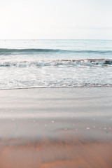 Close-up of sand and waves