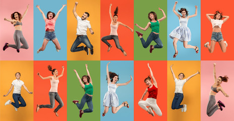 Freedom in moving. pretty happy young women and man jumping and gesturing against colorful studio background. Runnin girl in motion or movement. Human emotions and facial expressions concept. Collage