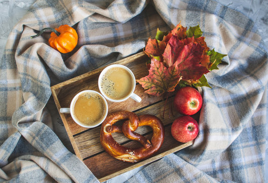 Tea Cup with Coffee Autumn Time Bakery Pretzel Toned Photo Knitting Scarf Blanket Yellow Leaves Gray Background