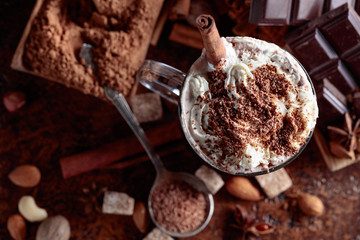 Cocoa with cream, cinnamon, chocolate pieces and various spices.