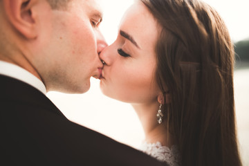 Sensual portrait of a young wedding couple. Outdoor