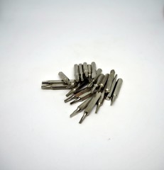 A pile of interchangeable screw driver with isolated white background