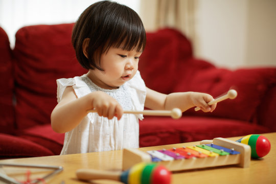 Baby Girl Play Xylophone At Home