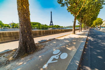 Bike lane by Seine river with world famous Tour Eiffel on the background