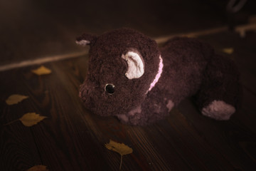 retro plush toy dog on a wooden background