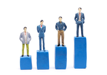 Miniature businessman and graph on white background, Business Growth concept