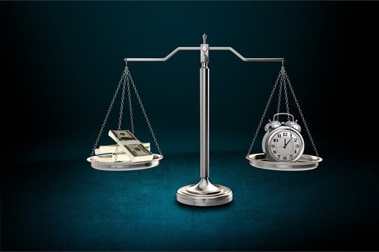 Justice Scales with money and alarm clock