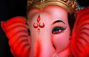 Closeup of Indian God Ganesha Idol,people offer prayers during Ganesh Chathurthi,annual festival