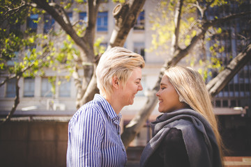 Fototapeta premium Close up image of a same sex female / lesbian couple enjoying sightseeing in the Cape Town South Africa city Center