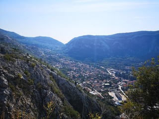 Fototapeta na wymiar Stunning Scenic Views from Various Stages of Climb up the Castle of San Giovanni in Kotor Montenegro containing Blue Sea and Mountain Views