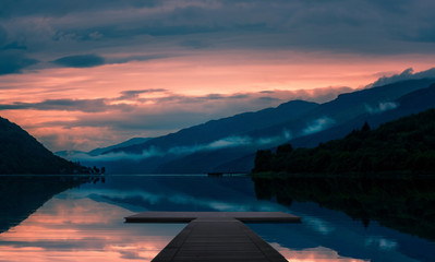 sunset on lake with jetty