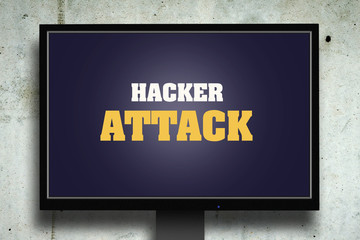 Hacker attack. The inscription on the monitor. Gray concrete background. Security concept. Computers.