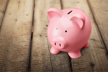 Pink piggy bank on desk
