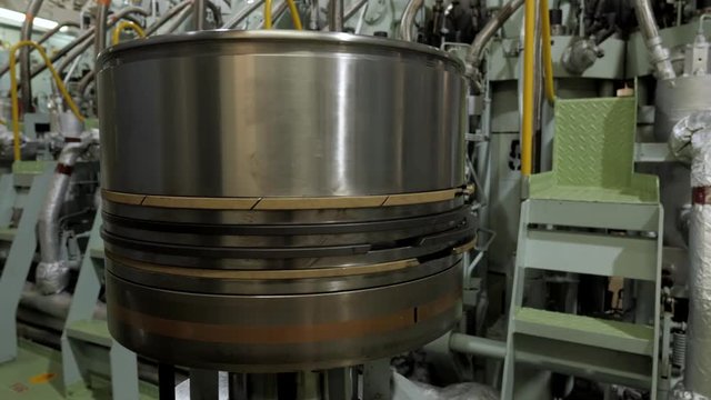 New piston near marine diesel engine of ship