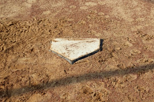 A view of the dirt home plate area on the ball diamond.