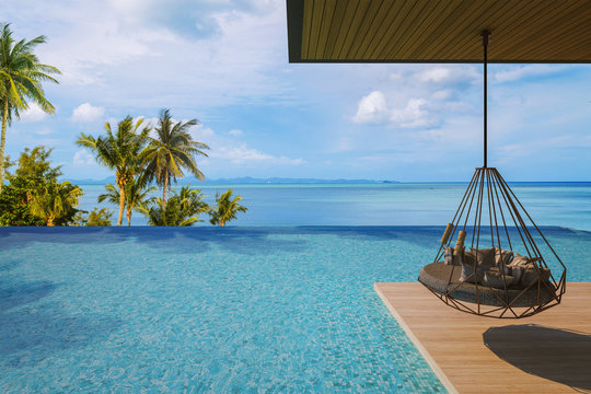 Beautiful Swing sofa on the Swimming pool waters outdoor tropical beach coastline with blue ocean sea horizon- 3D rendering