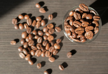 Coffee beans with glass bottle and sunlight