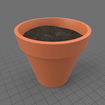 Terracotta flower pot with soil