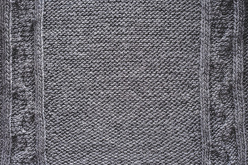 close up view of grey knitted cloth as backdrop