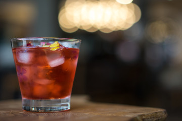 Tea of rosewater on wooden table.  Cafe lighting bokeh background concept.
