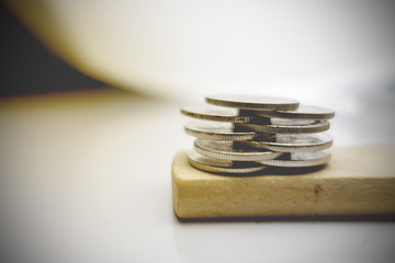 Coins stack on wood