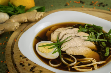 Soup with veal, egg and greens