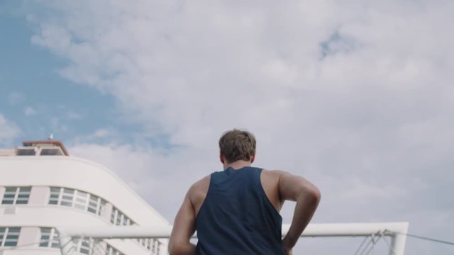 Young Man Athlete Feet Running Up Stairs Training Intense Cardio Workout Exercise Male Runner Legs Jogging On Steps In Urban City Background