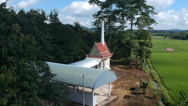 Full HD footage aerial view traditional crematory at countryside in Thailand. Drone shot.
