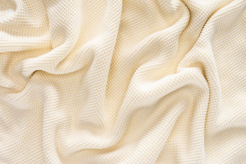 full frame of folded white woolen fabric background