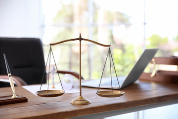 Scales of justice on desk in notary's office