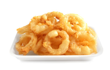 Plate with delicious golden breaded and deep fried crispy onion rings on white background
