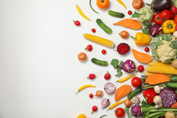 Flat lay composition with fresh vegetables and space for text on white background