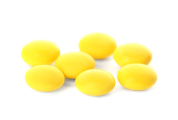 Color pills on white background. Medical care