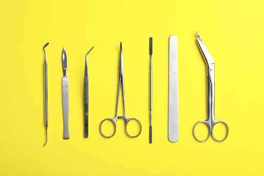 Set of medical instruments on color background, flat lay