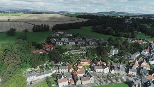 Aerial footage of the historical village of Culross on the North shore of the River Forth. White-harled houses, red-tiled roofs and cobbled streets. A location for the hit television series Outlander.