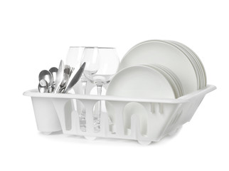 Rack with clean tableware and utensils on white background. Washing dishes © New Africa