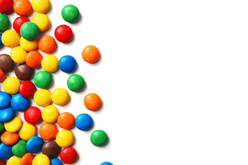 Obraz premium Tasty colorful candies on white background, top view