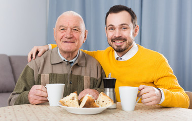 Elderly father and son breakfast