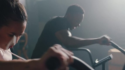 fitness athletes training using exercise bike diverse friends enjoying intense cardio workout challenge together in gym healthy lifestyle commitment