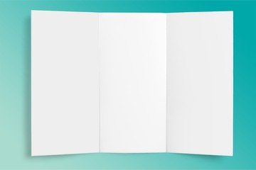 Blank white paper on wooden table background