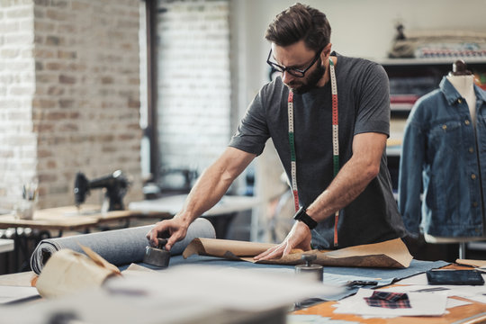 Fashion Designer Working In His Studio