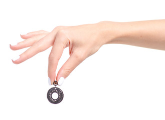 Black earrings stones jewelry bijouterie in hand on a white background isolation