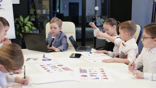 Group Of Children Work In A Modern Office