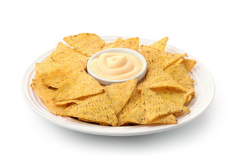 Dish of nacho chips and dip sauce