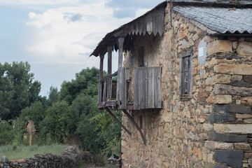 wooden balcony in a ruined rustic house