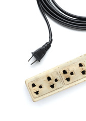 Old and unsafe power strip with illuminated switch isolated on white background