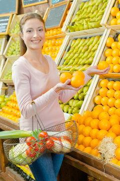 woman buying oranges