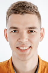 Obraz premium Portrait of a boy in a photo studio. Young Man posing on a white background.