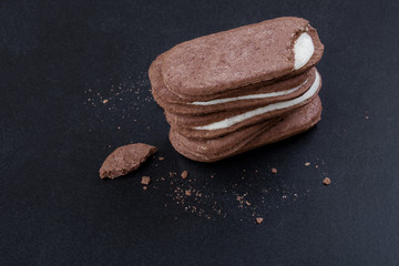 Chocolate sandwich cookies with white cream filling