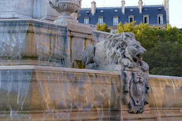 Fountain Saint-Sulpice with lion and running water in Paris, France - 224409819